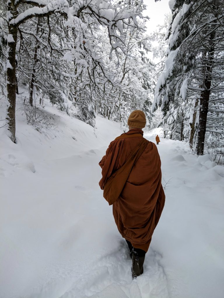 Photo of monks walking alms through the snow in White Salmon