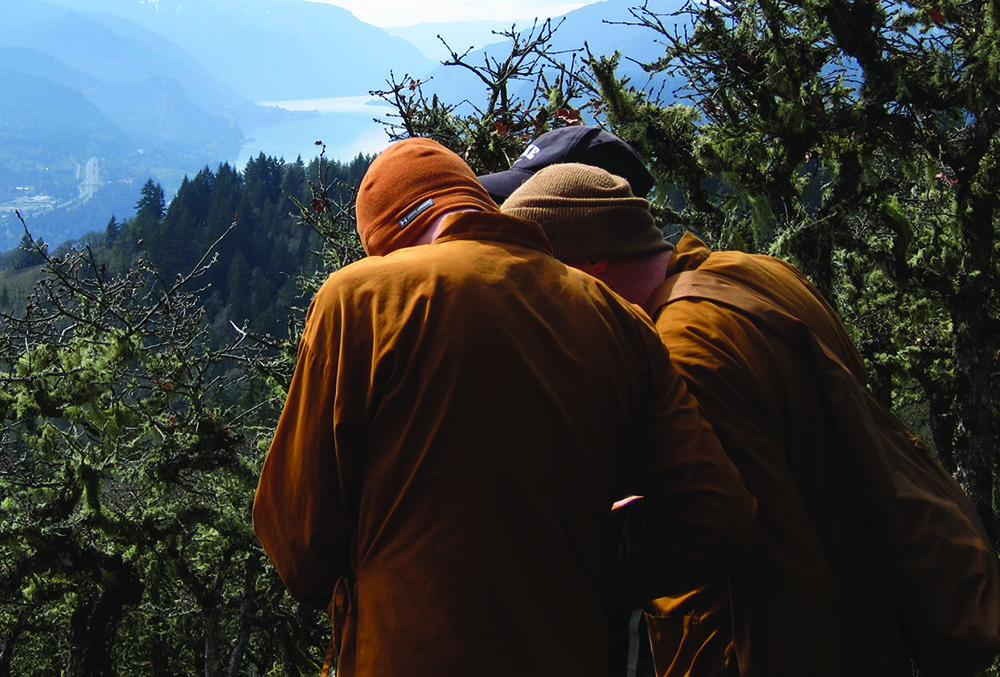 3 Buddhist monks discussing planning