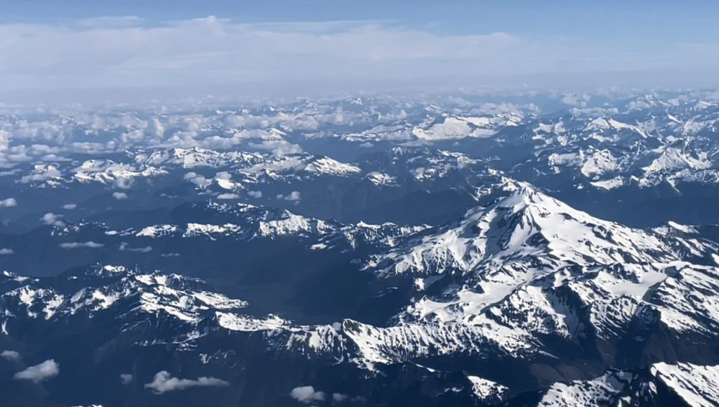 Photo: Aerial photo of snow capped Cascades in Washington State.